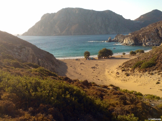 To pick the wild herbs that you can smell all the time at Psili Ammos, Patmos, you have to climb the cliffs. At the same time we had a spectacular view of our camp under the tamarisk trees to the left.